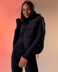 Woman wearing Go-To Puffer Vest - Black | Model:Kirstyn | Size:S