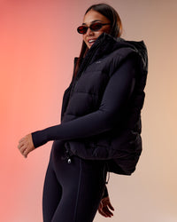 Woman wearing Go-To Puffer Vest - Black | Model:Kirstyn | Size:S