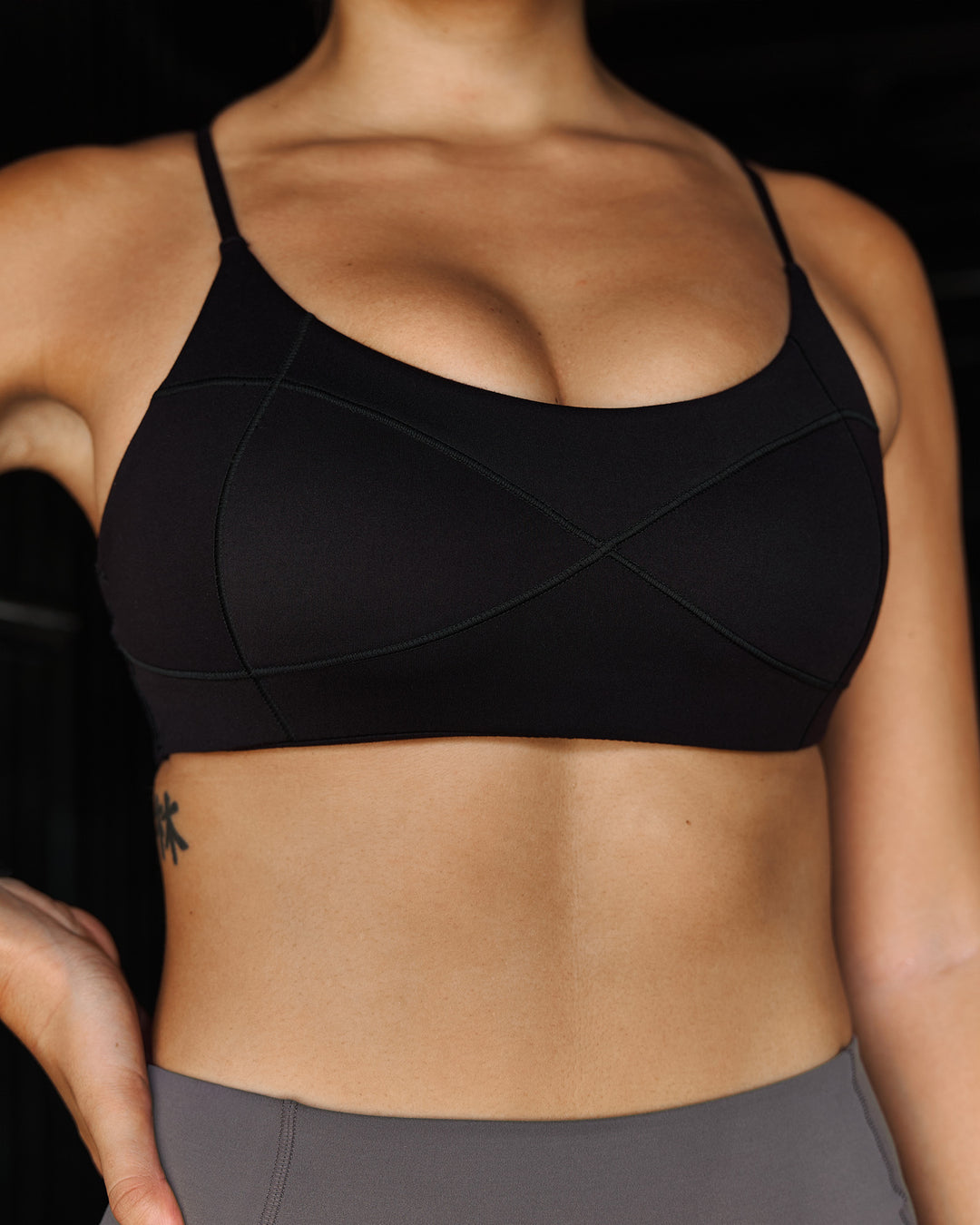 Woman wearing Infinite Contour Sports Bra - Black | Model:Stella | Size:S