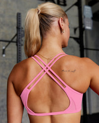 Woman wearing Interstellar Sports Bra - Candy Pink | Model:Hannah | Size:S