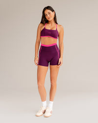 Woman wearing Liberate Contrast High-Rise 4" Short Pockets - Plum Caspia-Ultra Pink | Model:Jordi | Size:S