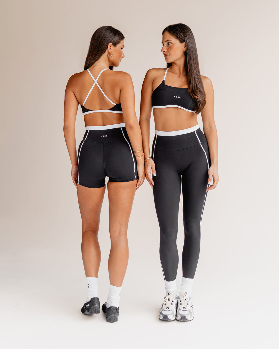 Woman wearing Liberate Sports Bra - Black-White | Model:Both | Size:S