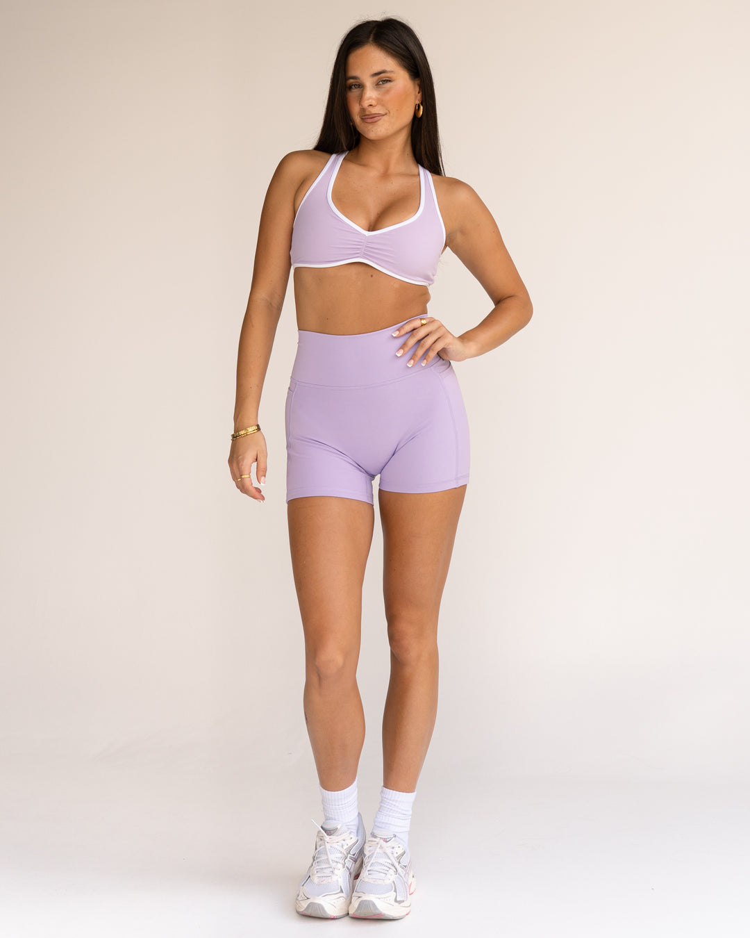 Woman wearing Luminous Sports Bra - Pale Lilac-White | Model:Jordi | Size:S