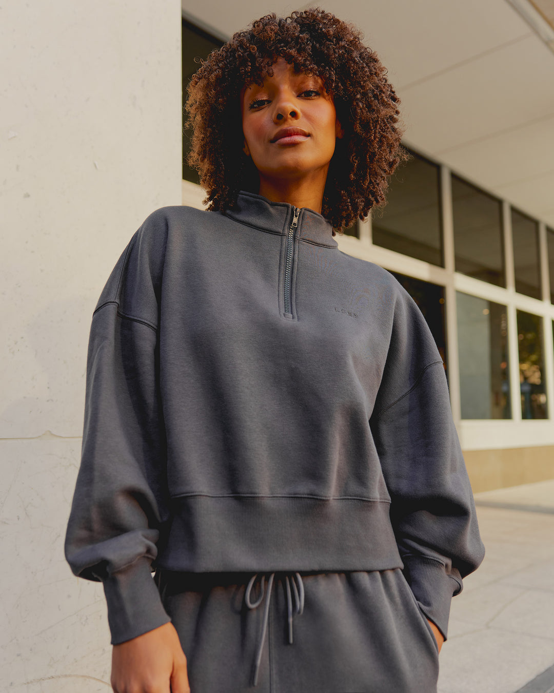 Woman wearing MVP 1/2 Zip Oversized Sweater - Dark Storm | Model:Tomi | Size:Dark Storm