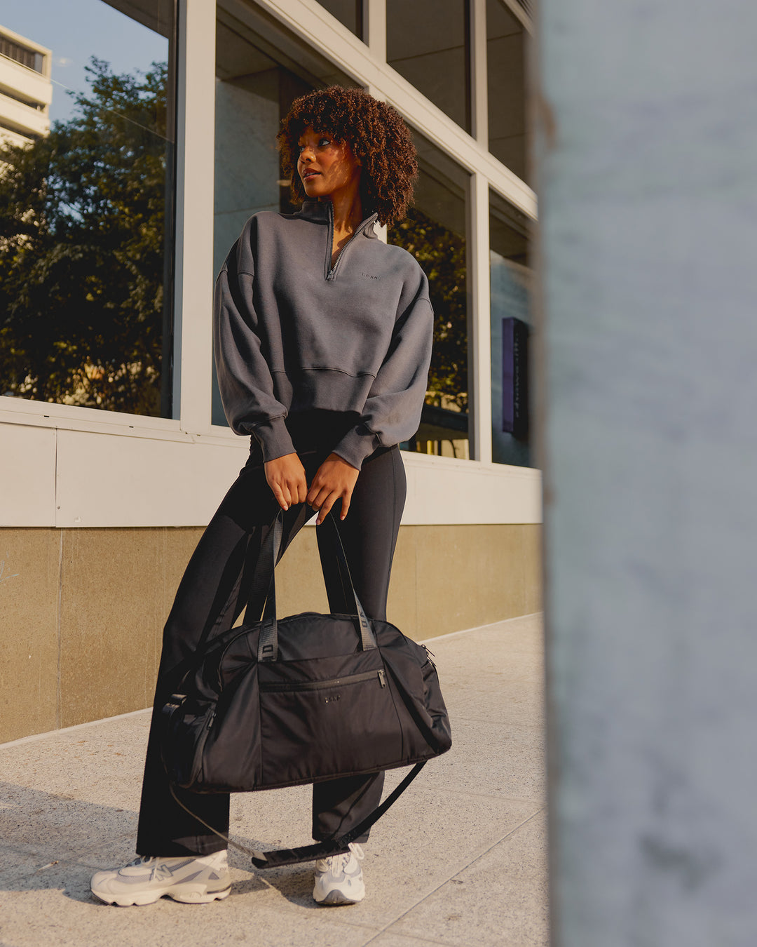Woman wearing MVP 1/2 Zip Oversized Sweater - Dark Storm | Model:Tomi | Size:Dark Storm