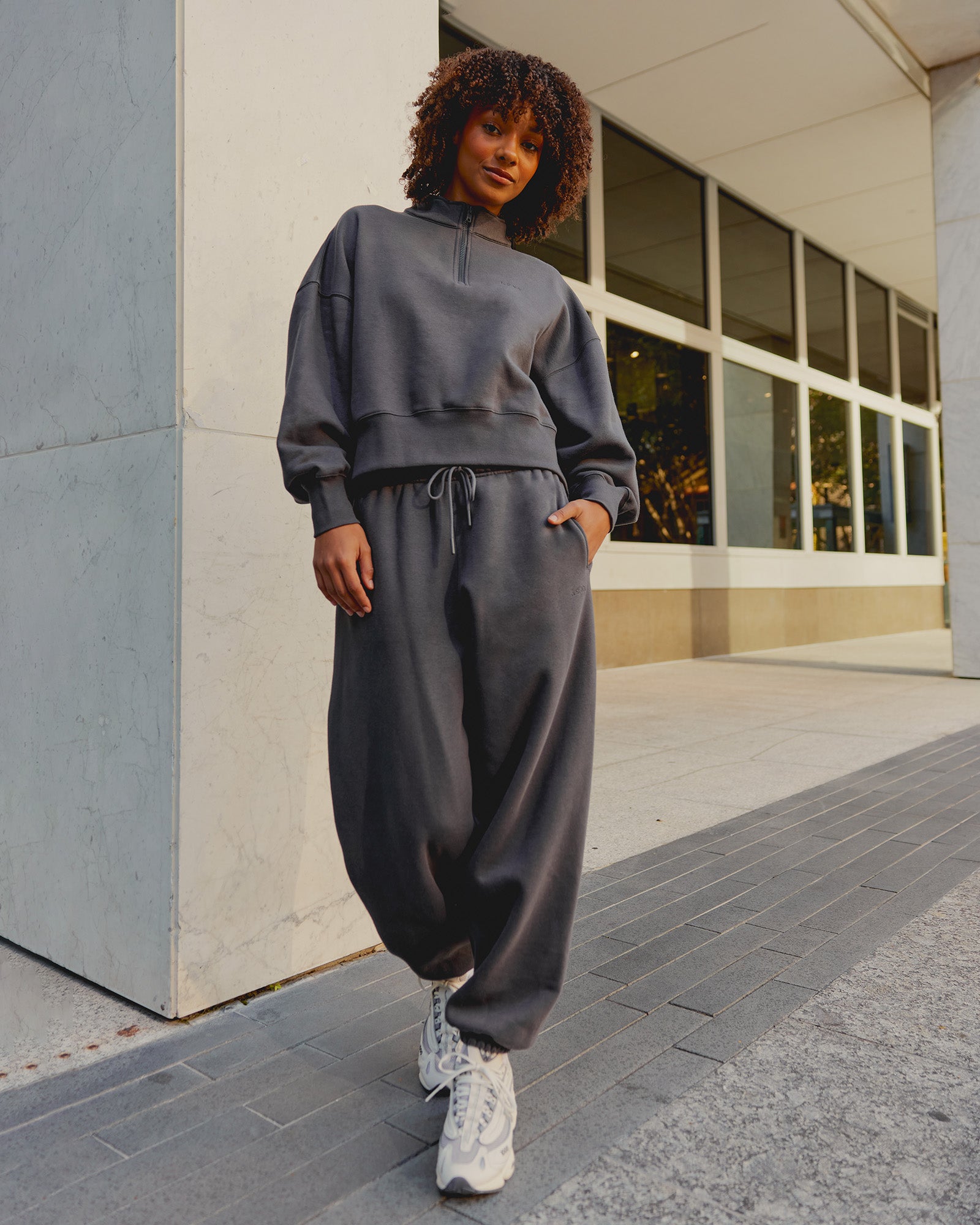 Woman wearing MVP Oversized Slouchy Fit Track Pant - Dark Storm | Model:Tomi | Size:S
