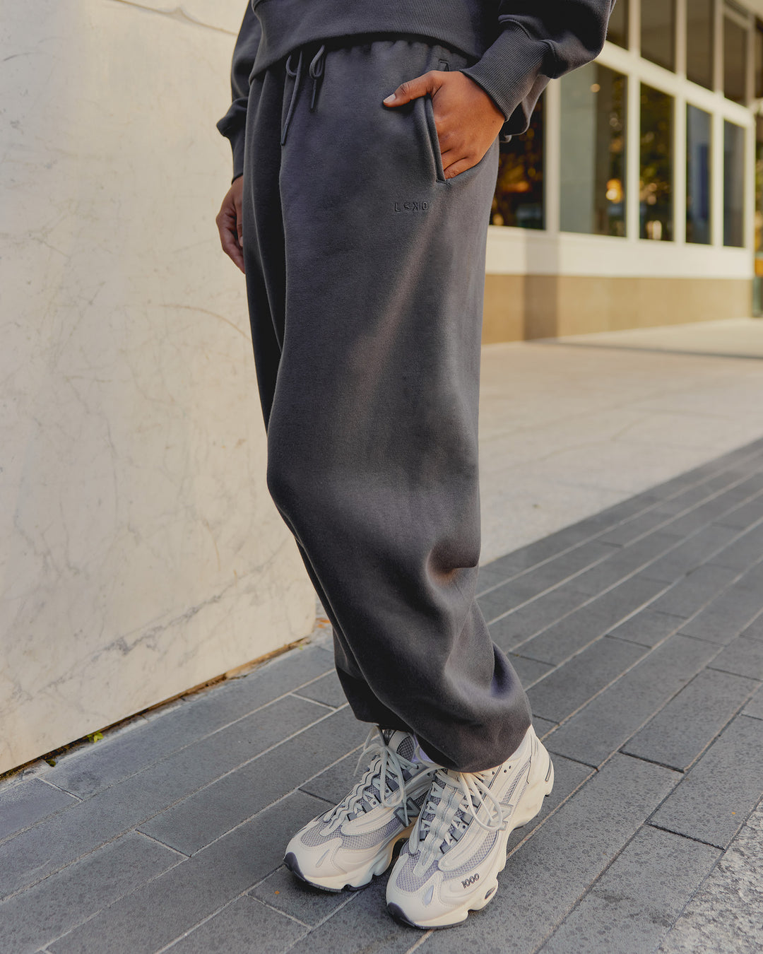 Woman wearing MVP Oversized Slouchy Fit Track Pant - Dark Storm | Model:Tomi | Size:S