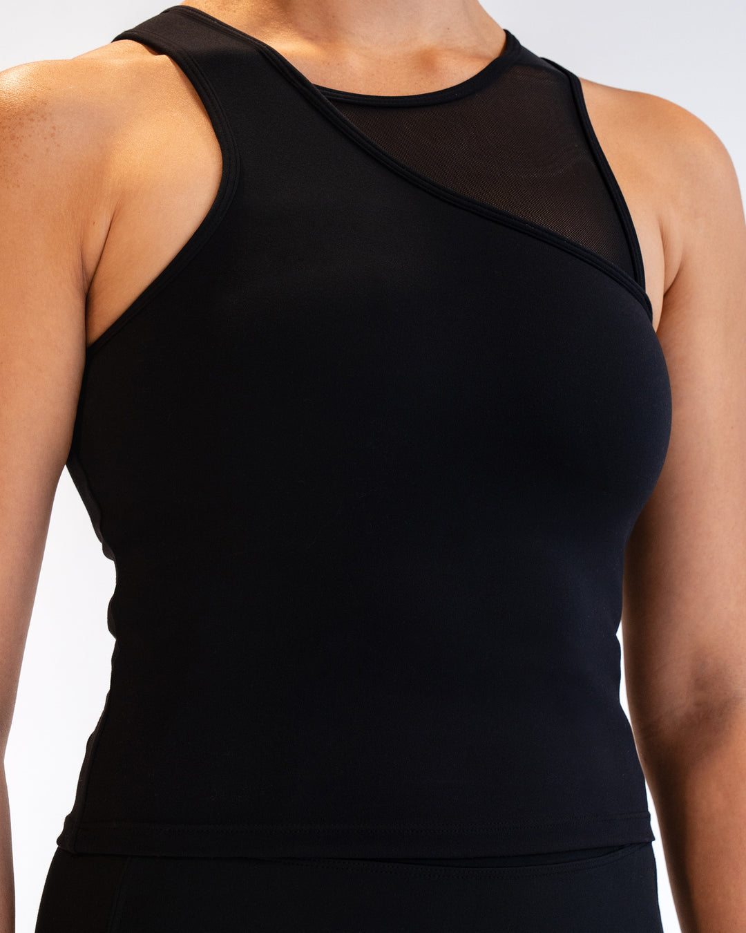 Woman wearing Motion Mesh Shelf Bra Tank - Black | Model:Sarah | Size:S