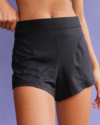 Woman wearing Movement CloudFLX 3" Short - Black | Model:Tali | Size:S