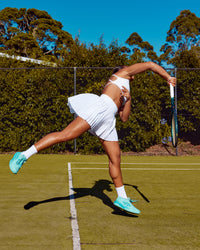 Woman wearing Precision Active Skirt - White | Model:Laquisa | Size:S