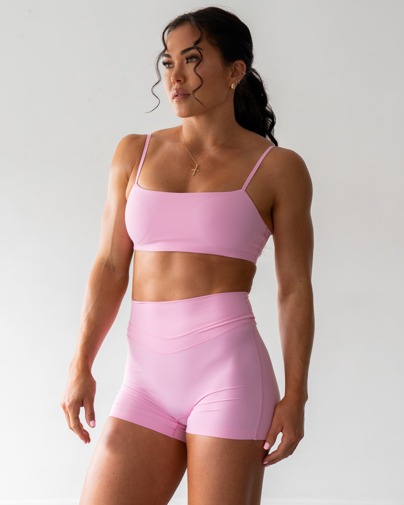Woman wearing Rebel Heart Sports Bra - Pink Frosting | Model:Emily | Size:S