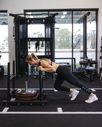 Woman wearing Rep Ultra High-Rise 7/8 Legging Pockets - Black-Retro Blue | Model:Bronte | Size:S