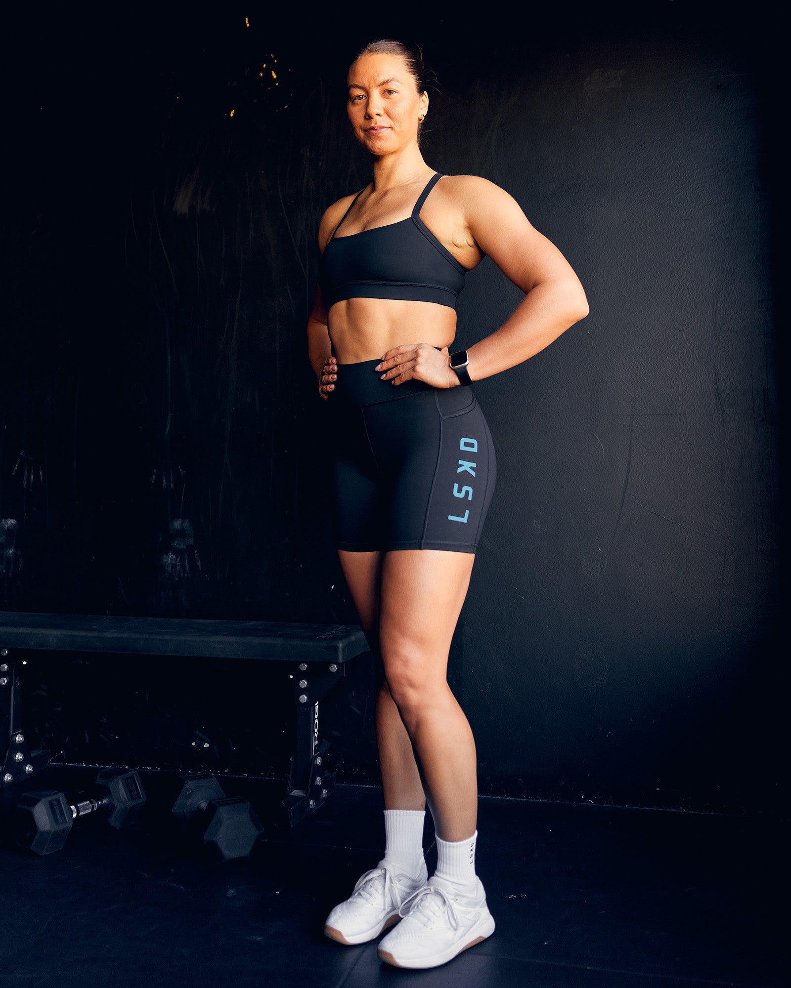 Woman wearing Rep Ultra High-Rise 6" Short Pockets - Black-Blue Atoll | Model:Bailey | Size:S