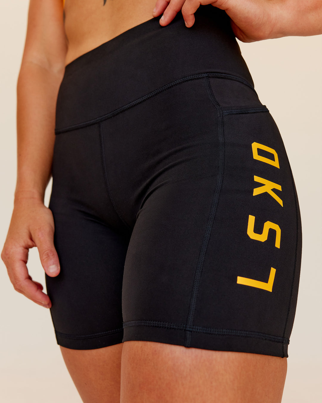 Woman wearing Rep Ultra High-Rise 6&quot; Short Pockets - Black-Zinnia | Model:Tenaya | Size:S
