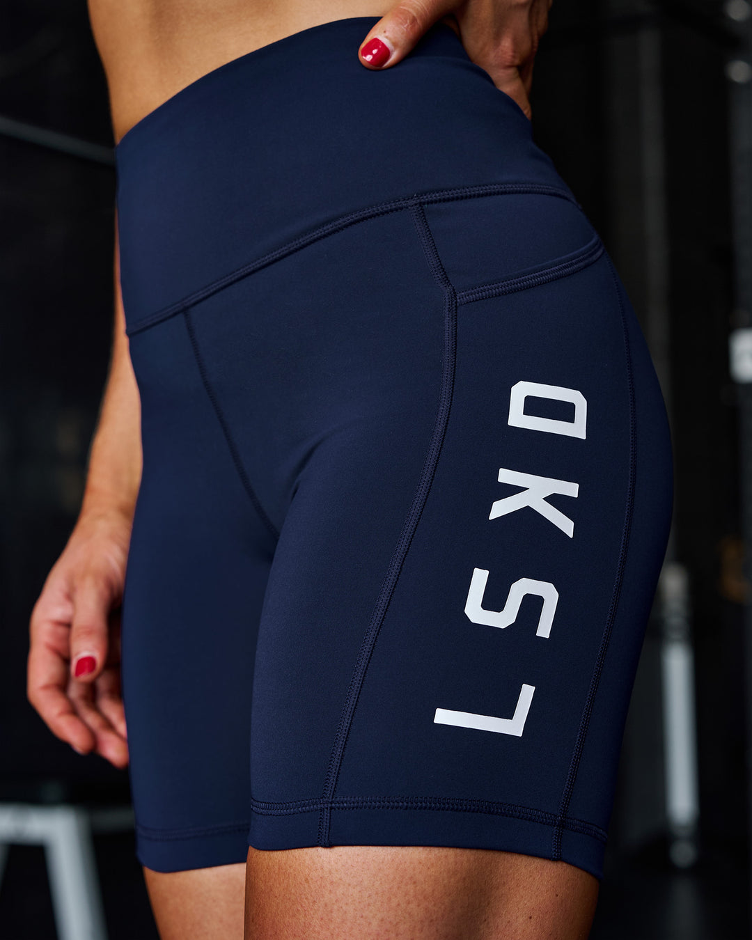 Woman wearing Rep Ultra High-Rise 6" Short Pockets - Future Navy-White | Model:Ella | Size:S