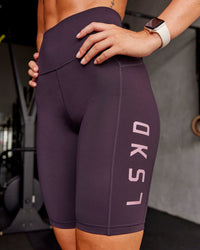 Woman wearing Rep Ultra High-Rise 9" Short Pockets - Midnight Plum-Marshmallow | Model:Roisin | Size:S