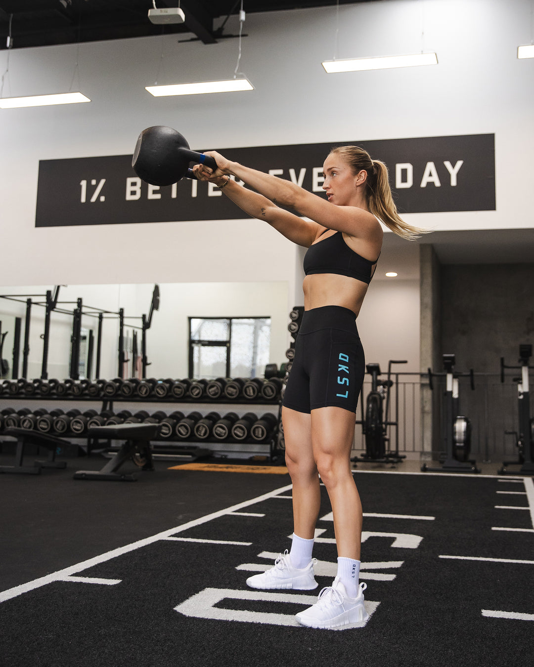 Woman wearing Rep Ultra High-Rise 6&quot; Short Pockets - Black-Retro Blue | Model:Bronte | Size:S