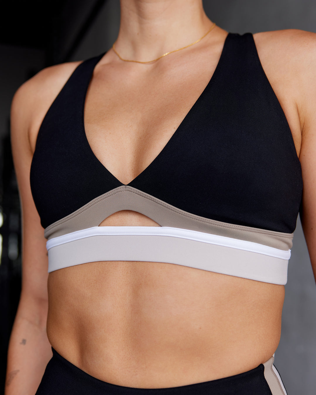 Woman wearing Revitalise Sports Bra - Black-Multi | Model:Shae | Size:S