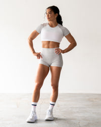 Woman wearing Run With It Ultra Cropped Tee - White-Grey Marl | Model:Emily | Size:S