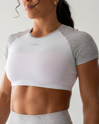 Woman wearing Run With It Ultra Cropped Tee - White-Grey Marl | Model:Emily | Size:S
