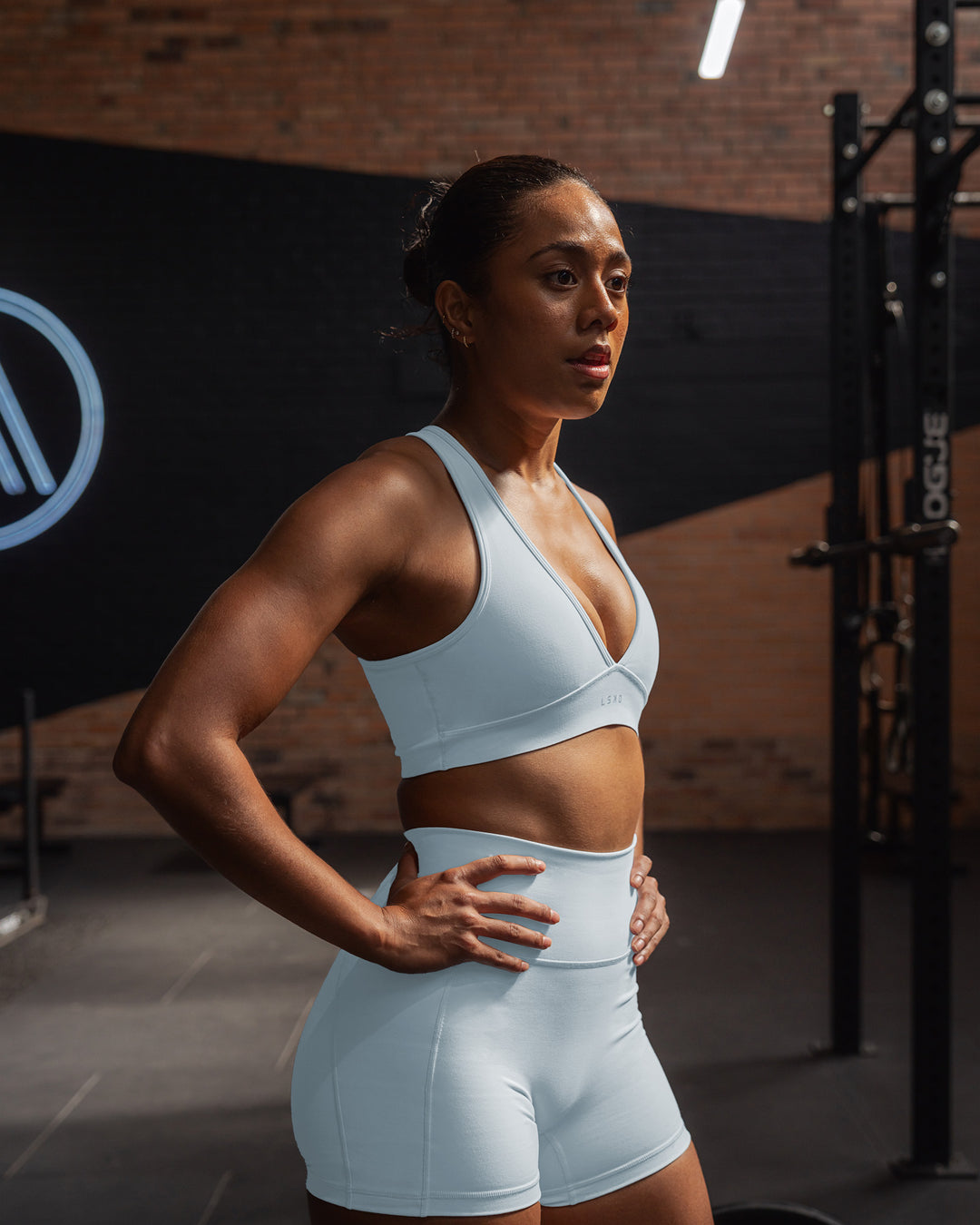 Woman wearing Stamina Sports Bra - Skyride | Size:S