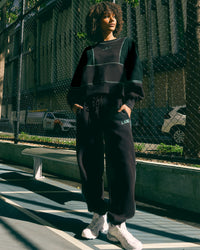 Woman wearing Stitch Up Fleece Sweat Pant - Black/Dark Moss | Model:Tomi | Size:S