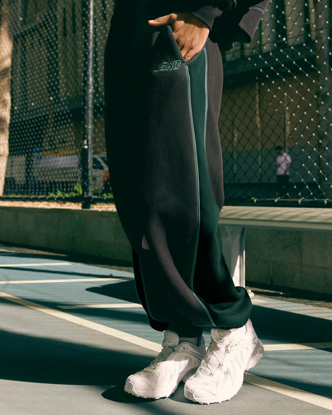 Woman wearing Stitch Up Fleece Sweat Pant - Black/Dark Moss | Model:Tomi | Size:S