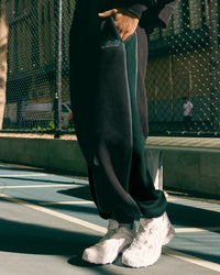 Woman wearing Stitch Up Fleece Sweat Pant - Black/Dark Moss | Model:Tomi | Size:S