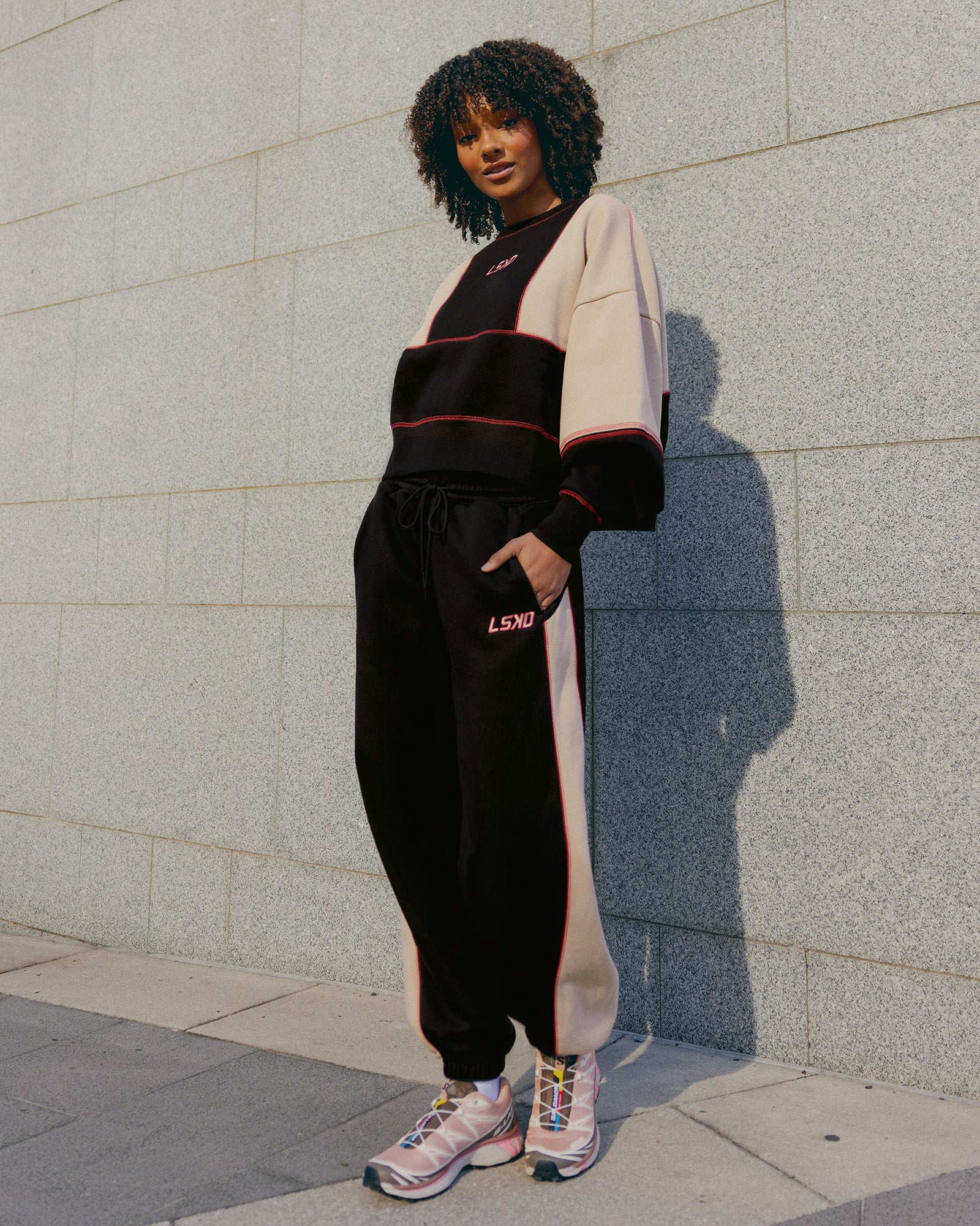 Woman wearing Stitch Up Fleece Sweat Pant - Black/Shale Beige | Model:Tomi | Size:S