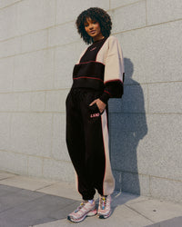 Woman wearing Stitch Up Fleece Sweat Pant - Black/Shale Beige | Model:Tomi | Size:S