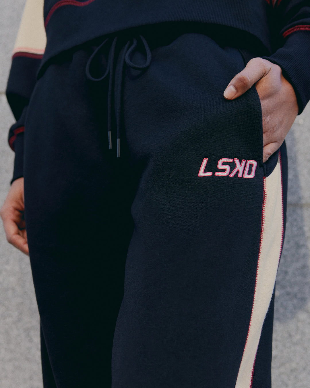 Woman wearing Stitch Up Fleece Sweat Pant - Black/Shale Beige | Model:Tomi | Size:S