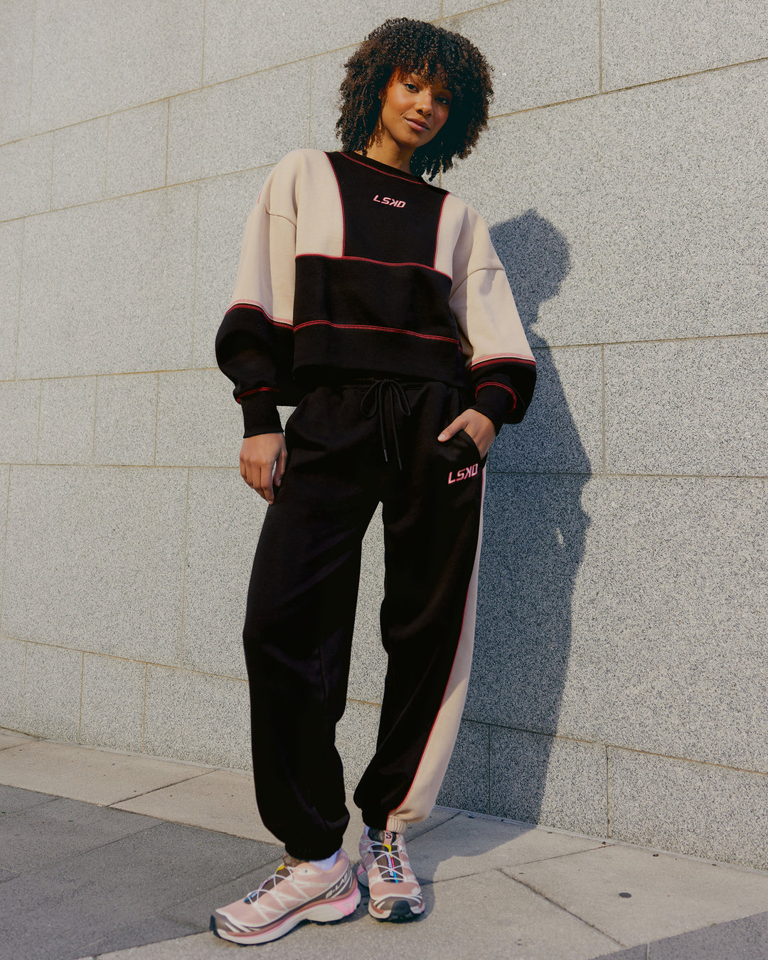 Woman wearing Stitch Up Oversized Fleece Sweater - Black-Shale Beige | Model:Tomi | Size:S