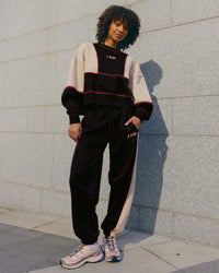 Woman wearing Stitch Up Oversized Fleece Sweater - Black-Shale Beige | Model:Tomi | Size:S