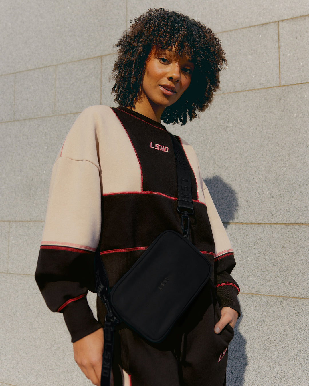 Woman wearing Stitch Up Oversized Fleece Sweater - Black-Shale Beige | Model:Tomi | Size:S