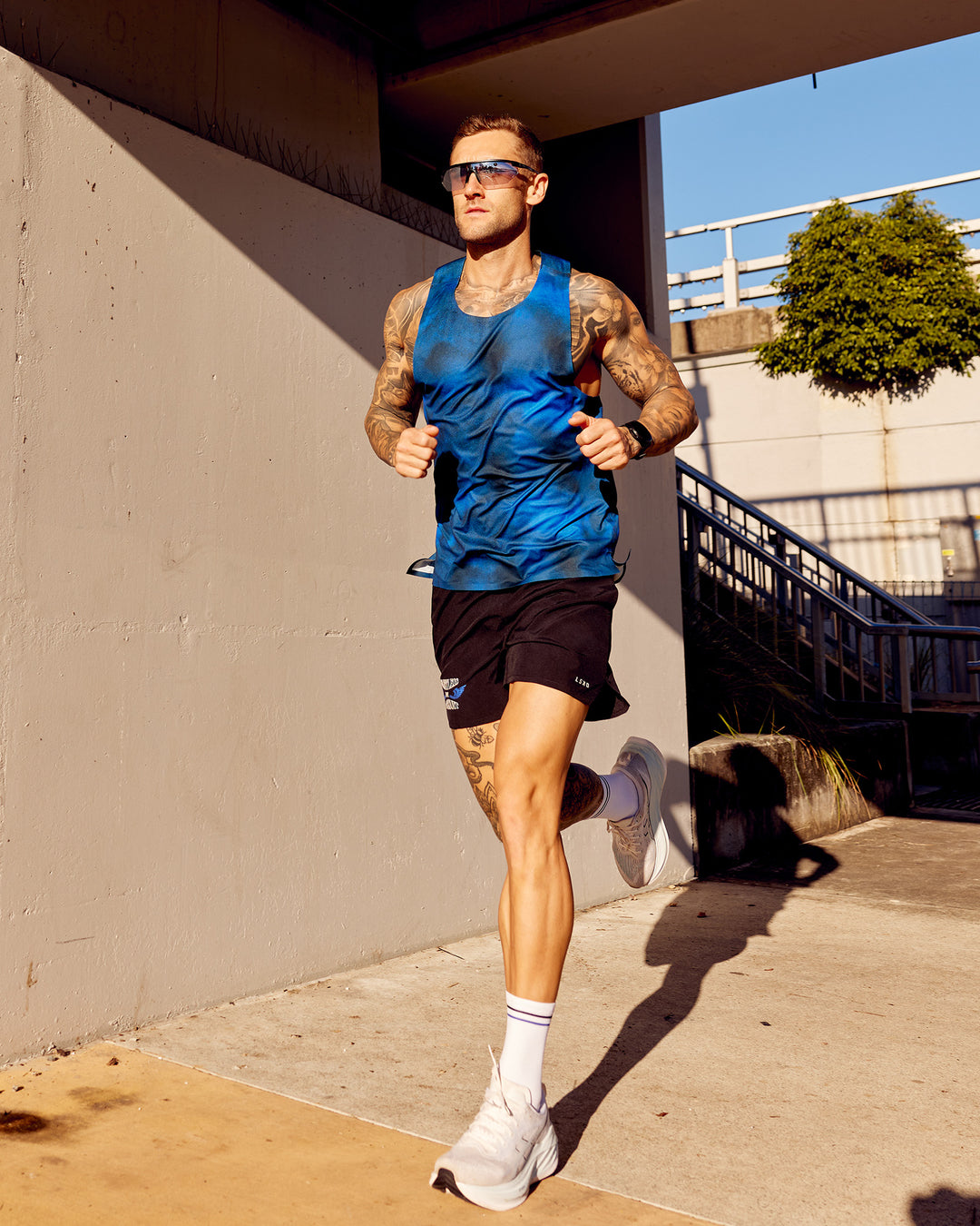 Man wearing Tommy Newell Pace 5&quot; Lined Performance Short - Black | Model:Tommy | Size:S