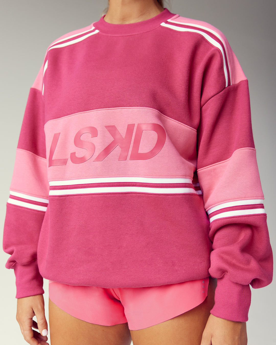 Woman wearing A-Team Sweater Oversize - Vivacious-Hot Pink | Model:Gwynn | Size:S