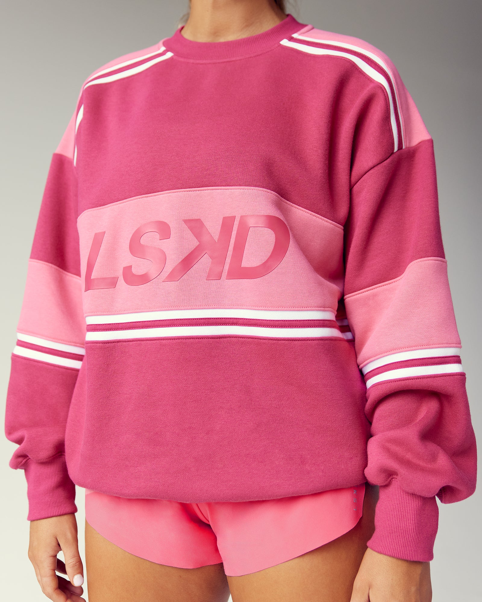 Woman wearing A-Team Sweater Oversize - Vivacious-Hot Pink | Model:Gwynn | Size:S