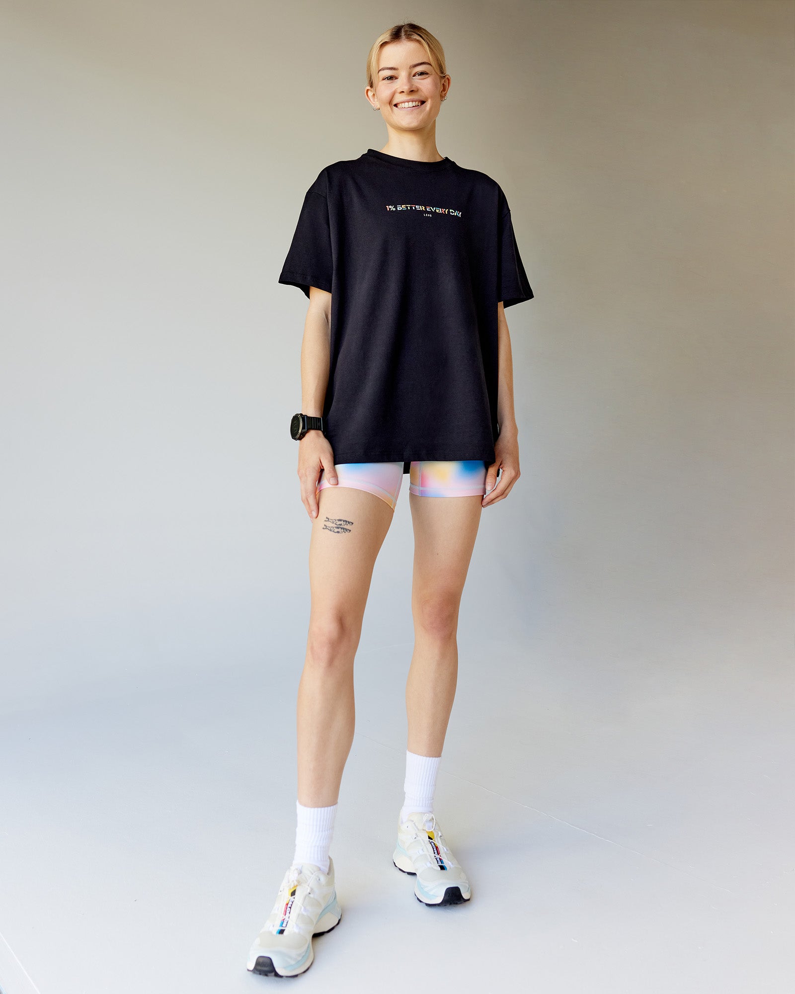 Woman wearing Unity Go-To FLX Cotton Tee - Black-Rainbow | Model:Karelia | Size:S