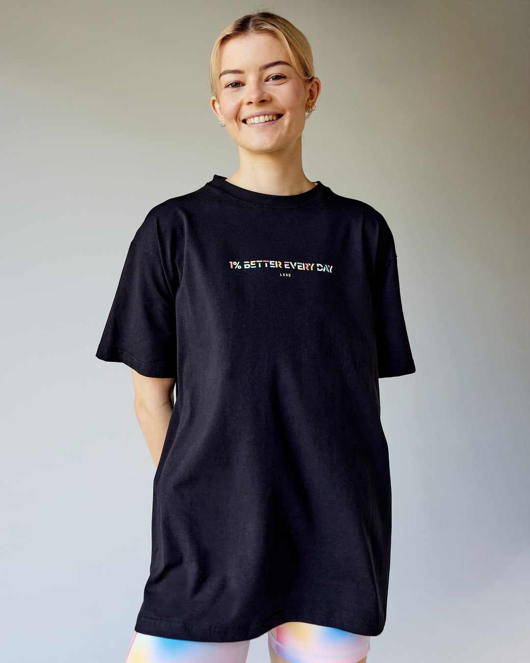 Woman wearing Unity Go-To FLX Cotton Tee - Black-Rainbow | Model:Karelia | Size:S
