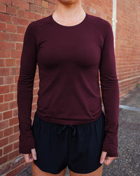 Woman wearing AeroFLX+ Seamless Long Sleeve Tee - Cherry Lacquer/Cherry Lacquer | Size:S