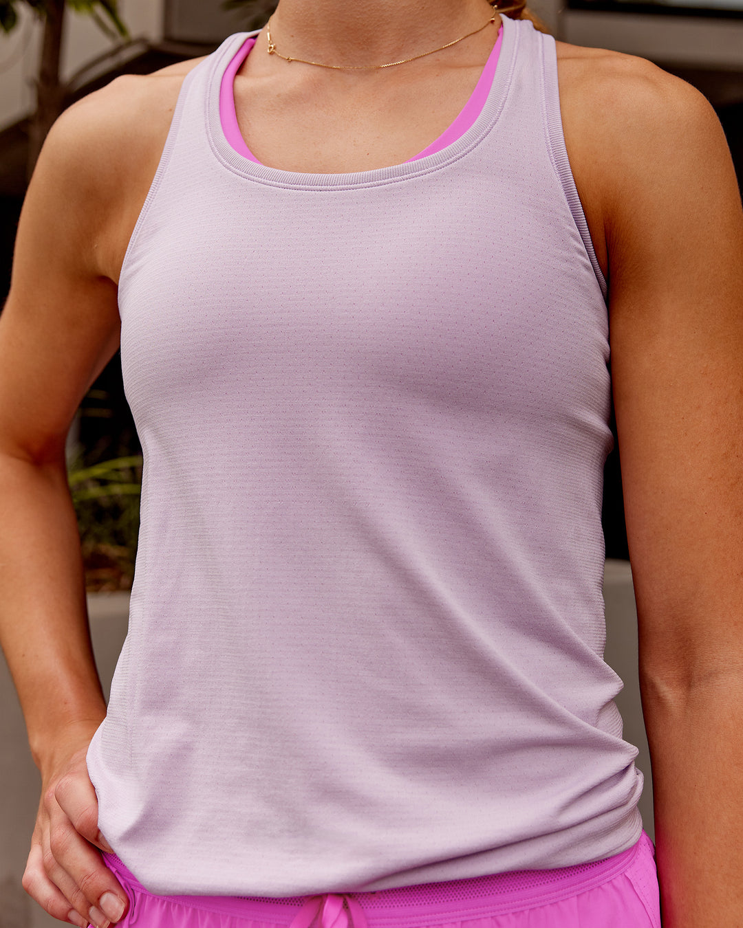 Woman wearing AeroFLX+ Seamless Tank - Fair Orchid/Fair Orchid | Model:Monique | Size:S