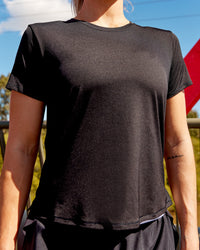 Woman wearing Pace Running Tee - Black | Model:Hannah | Size:S
