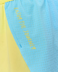 Woman wearing GG Accelerate 3" Mid-Rise Running Short - Baltic Sea-Lemon | Model:Grace | Size:S