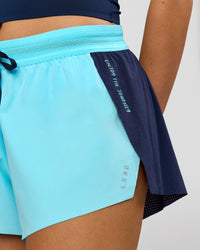 Woman wearing GG Accelerate 3" Mid-Rise Running Short - Future Navy-Baltic Sea | Model:Grace | Size:S