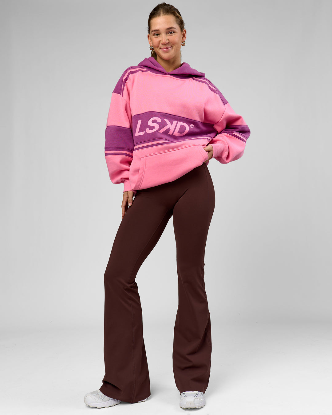 Woman wearing A-Team Oversized Hoodie - Candy Pink-Boysenberry | Model:Amity | Size:S