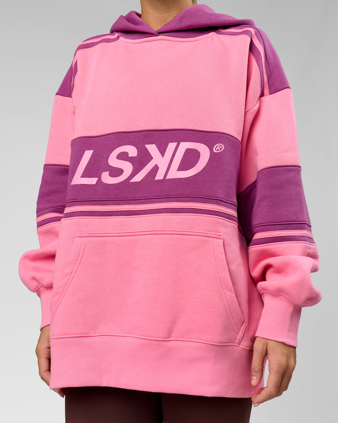 Woman wearing A-Team Oversized Hoodie - Candy Pink-Boysenberry | Model:Amity | Size:S