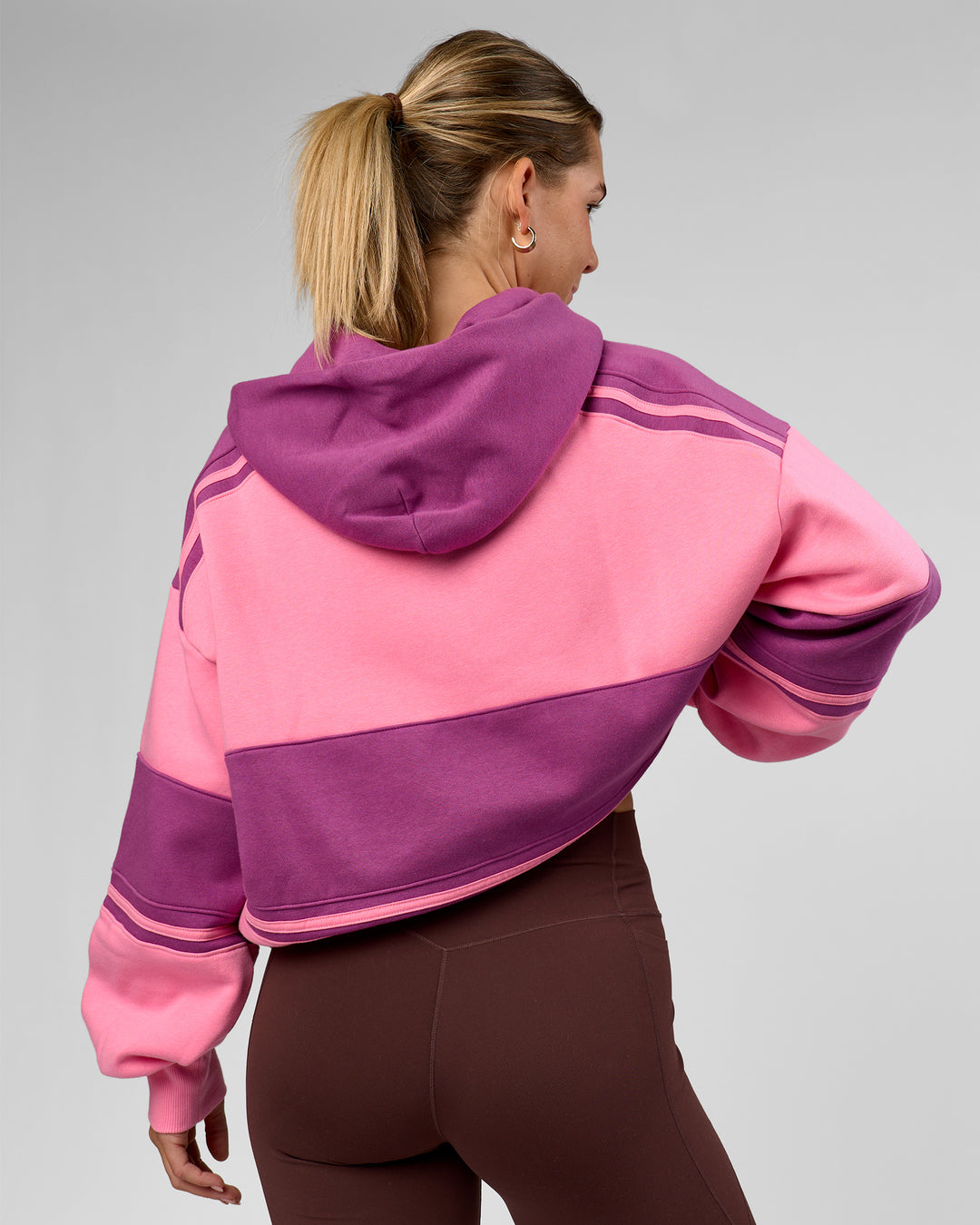 Woman wearing A-Team Oversized Hoodie - Candy Pink-Boysenberry | Model:Amity | Size:S