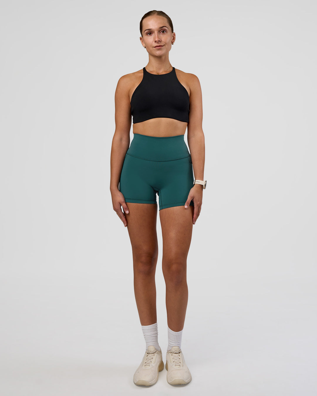 Woman wearing AMRAP High Neck Sports Bra - Black | Model:Myrte | Size:S