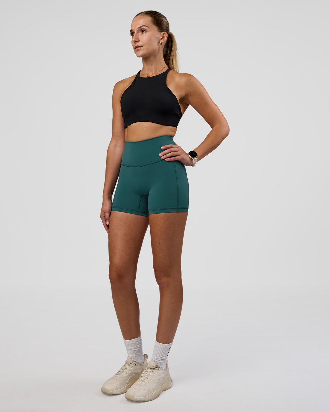 Woman wearing AMRAP High Neck Sports Bra - Black | Model:Myrte | Size:S