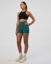Woman wearing AMRAP High Neck Sports Bra - Black | Model:Myrte | Size:S